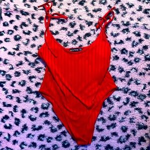 Red prettylittlething body suit